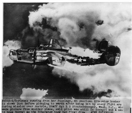B-24s over Vienna, Austria in 1944--on fire from enemy attack