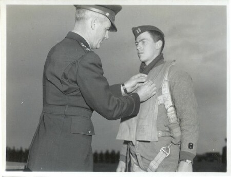 Captain Ellis A. Goodrich, of 206 North Cedar Street, Jefferson, Iowa, member of the 15th Air Force in Italy, is decorated by his commander, Gen. Nathan F. Twining, with the Distinguished Flying Cross - 459th BG, Army Air Corps Library and Museum